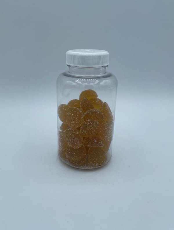 Clear bottle of Oregano and Ginger Gummies